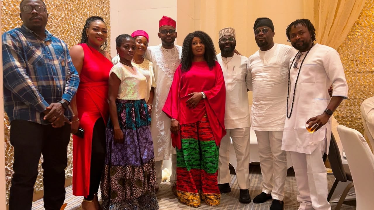 Command Ojo classmates together at a formal indoor celebration